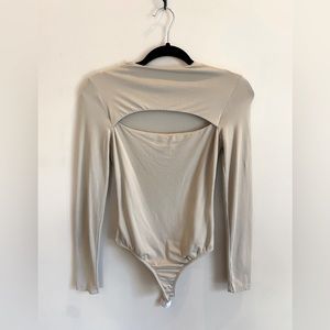 Beige long sleeve bodysuit